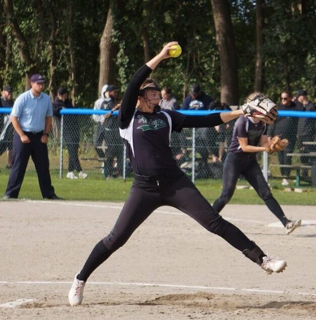 A softball pitcher mid motion at the Danish National Softball Championships